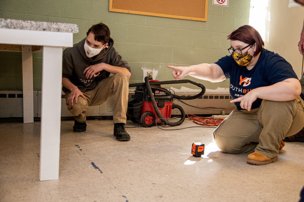 students work together to build a desk