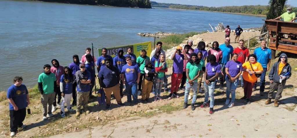 2022 Group of YouthBuild students from across the state pose in from of the River