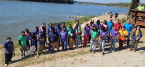 2022 Group of YouthBuild students from across the state pose in from of the River