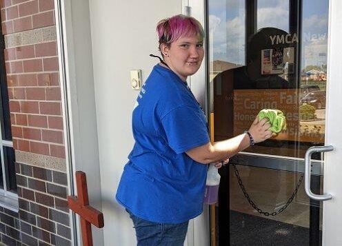 Student washes windows during Summer Work Experience program in Moberly, MO